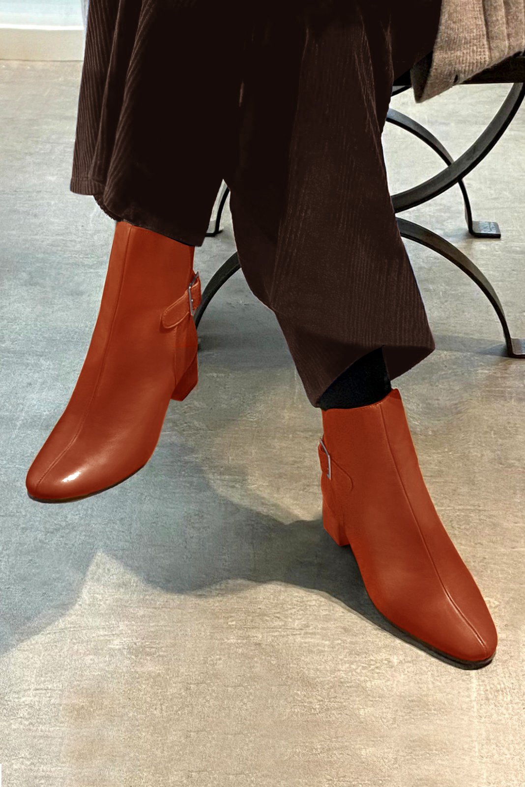 Terracotta orange women's ankle boots with buckles at the back. Round toe. Low block heels. Worn view - Florence KOOIJMAN